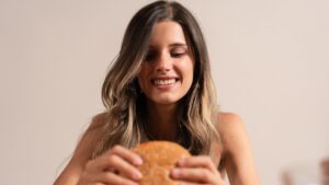 happy woman eating a burger
