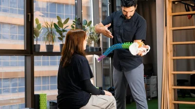 specialist explains medical trauma recovery to a patient